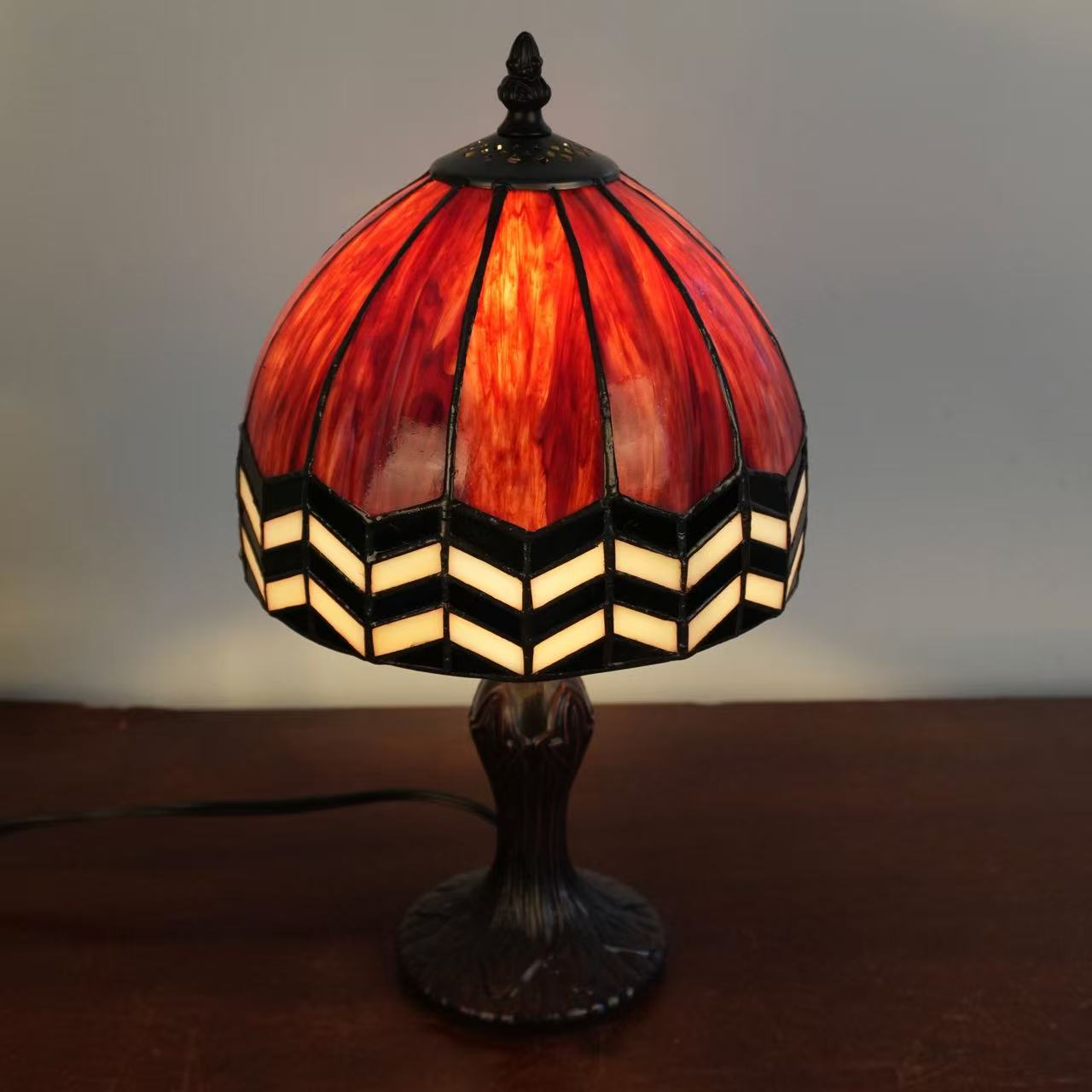 Image 4. Completed sample photographed from a raised angle, showing the illuminated glass panels and shade profile.